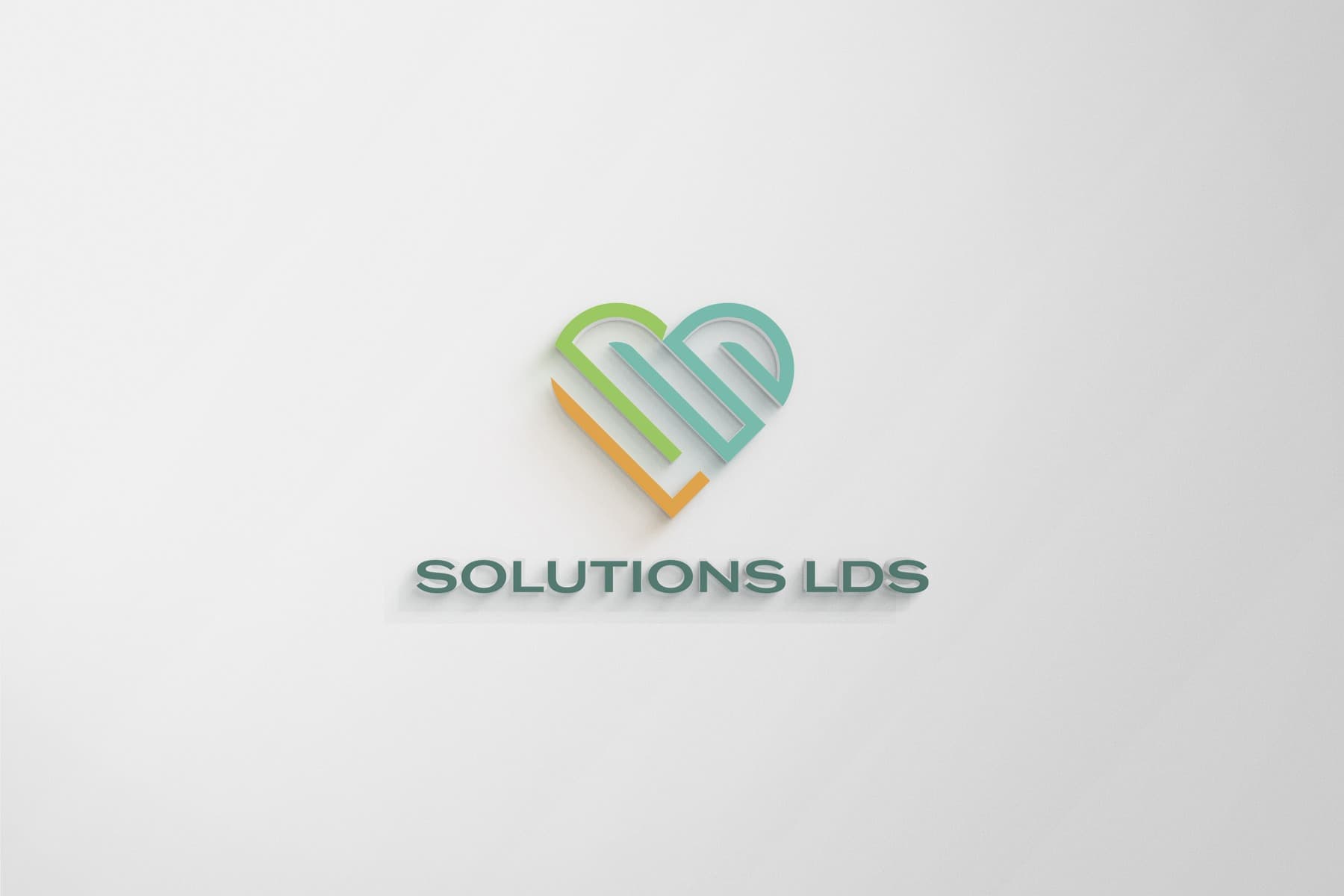 Solutions LDS heart-mark logo — 3D wall sign presentation mockup